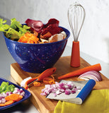 The blue spectacled garbage bowl is shown holding vegetable matter.