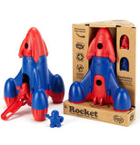 This plastic red and blue rocket comes with a pair of astronauts; one is red, the other blue. One rocket is shown in its cardboard packaging, while the other is shown outside its box with its door open.