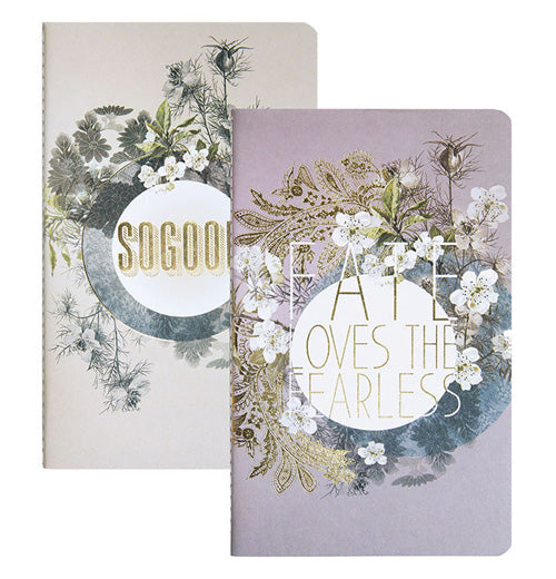 The Notebook is stacked on top of white notebook with the message "So Good" printed in Gold. 