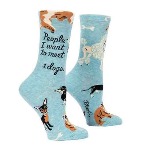 These light blue socks have a dog design with words that read "People to meet 1 Dogs" in black.