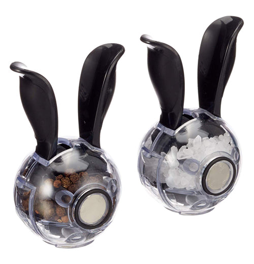 The "Mini Magnetic Set" Salt &amp; Pepper Grinders have rare earth magnets on the back to be attached to each other.