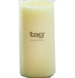 An ivory/off-white candle. Text on it say "Tag Candles."