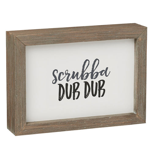 Box sign with wooden frame, says "Scrubba dub dub".