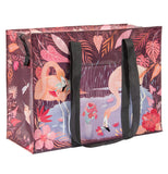 The 'Flamingo" Shoulder Tote Bag features flamingos holding red flowers in their beaks. 