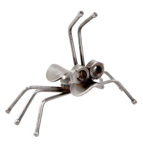 This small ant sculpture with six legs and two antennae is made of recycled metal.