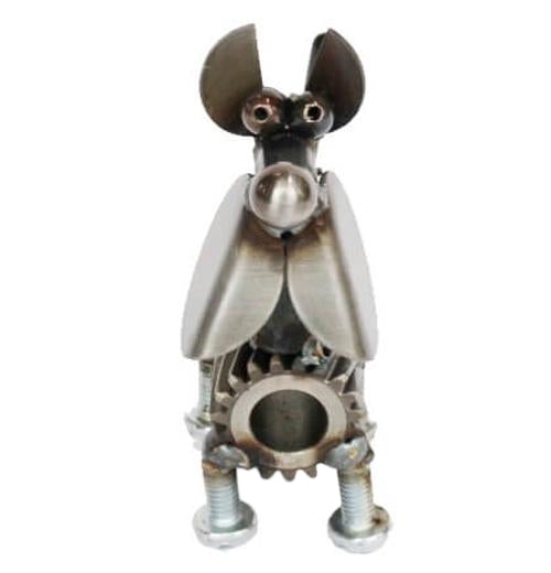 A dog made out of metal and gears is angled straight forward forward.