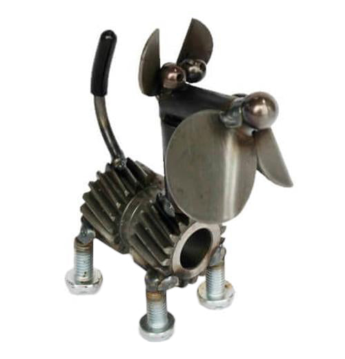 A dog made out of metal and gears is angled facing the right corner.