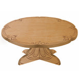 A beechwood cake pedestal with etched designs around the edge and the base.