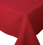 This red tablecloth is shown folded at the end of the table.