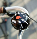 The black and white bike bell is shown tied to a bike handlebar.