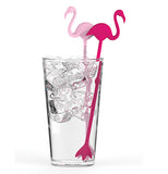 Two flamingo shaped stir sticks, one light pink and one magenta pink, in a clear glass with ice and a clear liquid. 