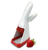 Strawberry slicester has a handle with a blade underneath it has red blades and bottom the rest is white it looks like a can opener.