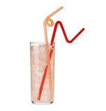A glass full of beverage and ice is shown with an orange straw and red straw.