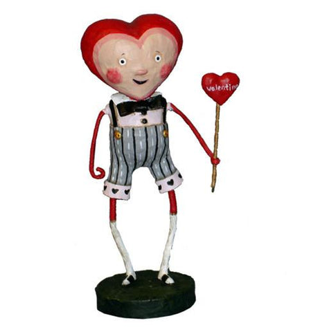 Male figurine with heart shaped head holding heart shaped wand that has sweetheart printed on it