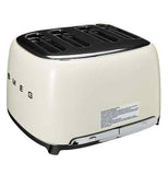  A cream colored toaster thats on its side with the letters SMEG on it.