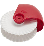 A white pastry wheel is attached to a red handle.