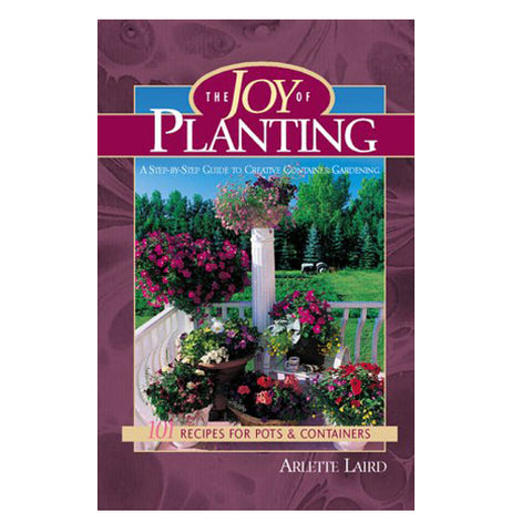The purple book of the Joy of Planting has picture of colorful flowers in the garden area. 