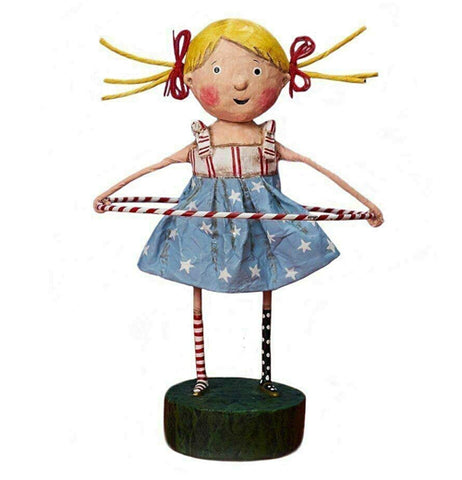 This girl figurine with blonde hair in pigtails is wearing a red and white striped shirt and a blue skirt with white stars. She is playing with a red and white striped hula hoop.