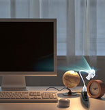 spaceman light is plugged into a USB port on a computer