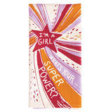 This folded dish towel shows a star with red, pink, and orange rays coming out of it with the text "I'm a Girl What's Your SuperPower?"