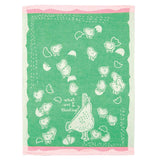The green towel with pink edges and the white chickens is shown completely unfolded.