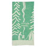 This green cloth dish towel is shown with a white design of a person operating a smoking barbecue outside a tent. Pine trees are shown in white against the green background. The words, "Inside Sucks" are shown in white lettering above the smoking barbecue.