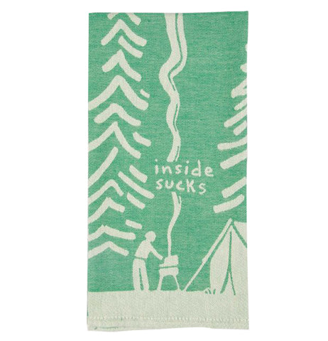 This green cloth dish towel is shown with a white design of a person operating a smoking barbecue outside a tent. Pine trees are shown in white against the green background. The words, "Inside Sucks" are shown in white lettering above the smoking barbecue.