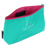 Make up & kiss hand bag that is green on the outside, the inside is pink.