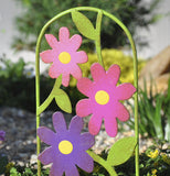 This is a picture of a mini wildflower gate that is purple,pink, dark pink flowers.