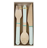 A set of wood silverware that has a mint paint job on the bottom half  of all the silverware. They are in the original package with the lid not on the box.