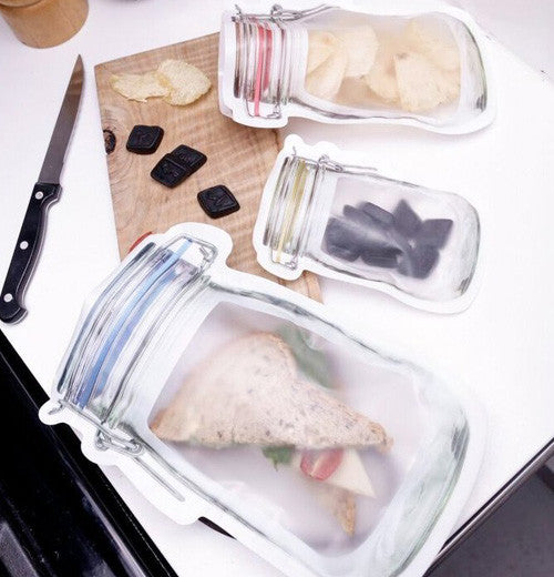 The three different sizes are filled with food.