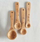 These beechwood spoons have pictures of bees and honeycombs adorning them.