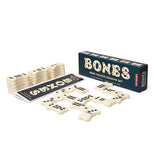 These white dominoes with black dots are shaped like dog bones. The box with the dominoes has the word, "Bones" in white lettering with black dots covering them.