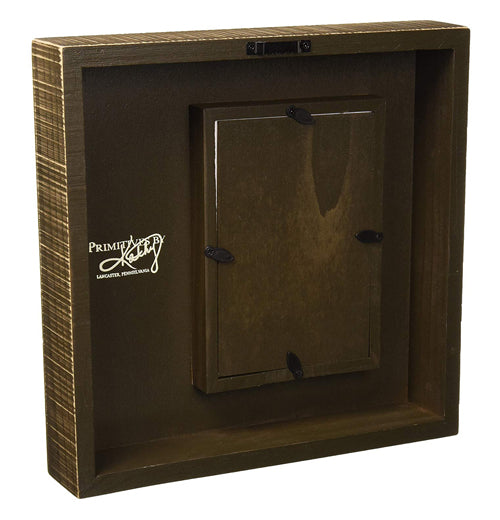 The back of the box sign is shown with the picture frame sticking out.