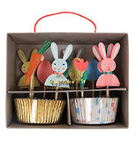 Kit with gold and silver cupcake holders with bunnies and paper carrots for decorations.
