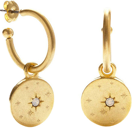 Two brass hoop earrings with an opal stone inset in the middle and a star design.