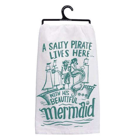 White and teal dish towel with a pirate, a mermaid, and a ship.