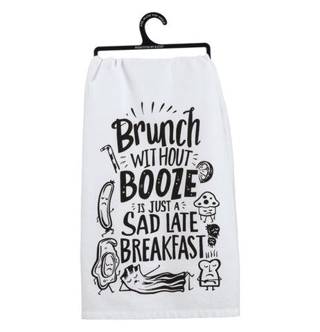 White cotton towel hanging from a black hook that says "Brunch Without Booze Is Just a Sad Breakfast" featuring food with faces on a white background.