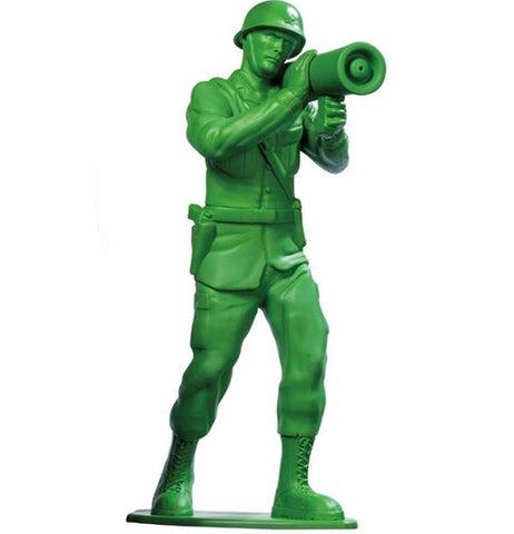 A green plastic army man toy carrying a bazooka.