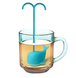 a whale tea infuser submerged in a tea glass with its water spew handle sticking out for easy extraction.