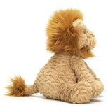 Sideview of tan Fuddlewuddle lion with an amber colored mane and tail tip.