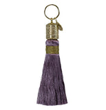 Purple and gold tassel with a gold hoop at the end.