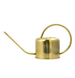 This steel open-top watering can is golden colored with a wide handle and long thin spout.