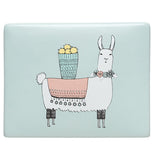 A top of a jewelry box. It's mostly pastel blue. In the middle there is a cartoonish white llama. The llama has pastel pink blanket and blue basket of pastel yellow fruit on its back and a floral wreath around its neck.