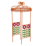 Mini metal orange Gazebo with pink flowers and green stems on two sides near the bottom of it.