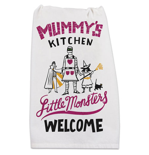 A white towel with the phrase mummy's kitchen featuring a little witch, a young vampire, and a mummy