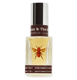 This perfume has a picture of a bee and says Honey and the Moon on it.