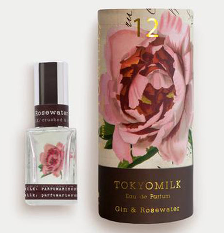 this is the perfume bottle next to the box with a flower decoration