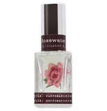The Gin and Rose Water No.12 perfume bottle has a pink flower on it.