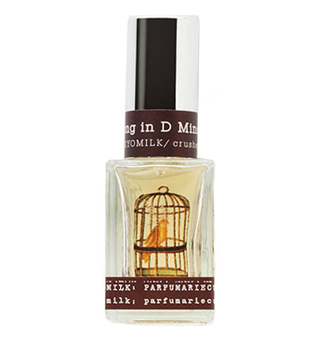 Perfume that has "Song in D Minor" printed on it. It has a bird in a bird cage illustrated on it.